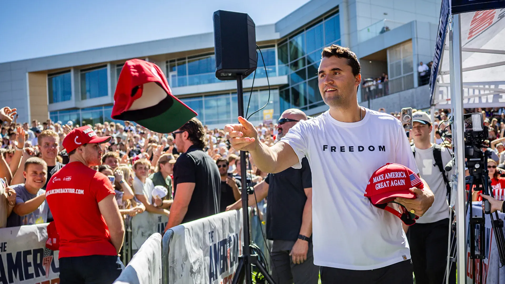 Charlie Kirk tosses hats to the crowd at Utah Valley University in Orem, Utah