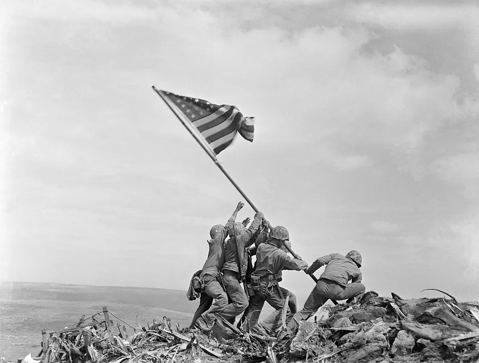 U.S. Marines raise the American flag atop Mount Suribachi during the Battle of Iwo Jima, February 23, 1945